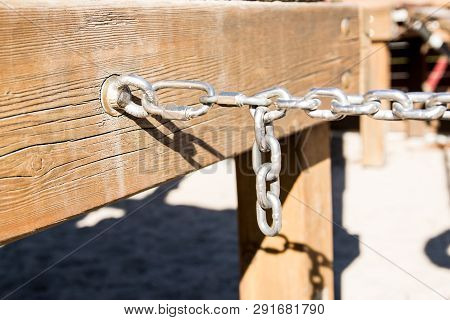 Metal Chain In Sun Day On The Nature Background. Business Concept.