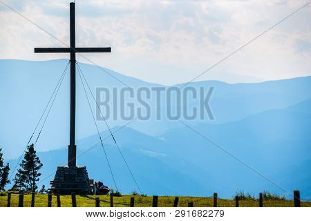 Cross On A Peak Of Rocky Austrian Mountain Schockl In Styria Graz. Place For Tourism And Hiking Recr