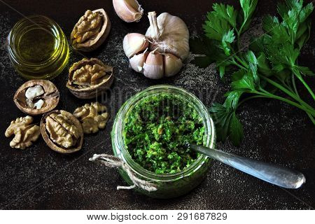 Walnut Pesto With Parsley. Homemade Pesto Sauce In A Jar. Top View. Vegan Pesto With Walnut And Pars