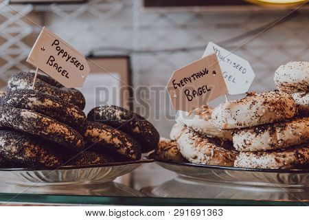 Close Up Of A Variety Of Bagels On Sale, Selective Focus.