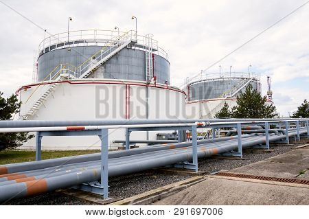 Liquid And Fluid Gas Or Oil Storage Tank, Holder, Container, Dramatic Sky Background Copy Space