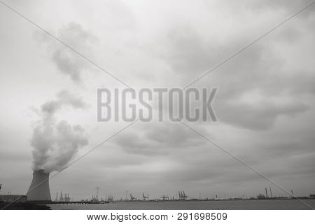 May 2016, Doel, Antwerp, Belgium, Cooling Towers Of The Nucleair Power Plant In Doel Next To The Riv