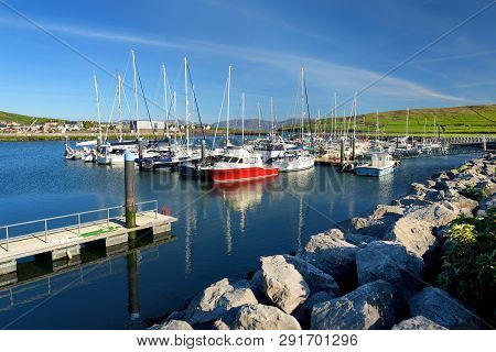 Colorful Fishing Boats And Yachts At The Harbor Of Dingle Town On The West Atlantic Coast Of Ireland
