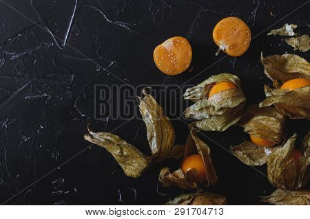 Physalis On A Dark Background. Berry  On A Dark Background. Golden Berries On A Dark Background. Pla