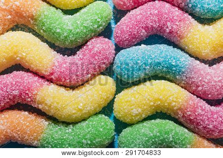 Background Of Colorful Candy. Multicolored Marmalade On A Blue Background. Background Pastel Colors.