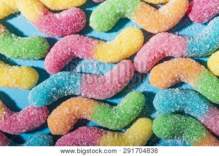 Background Of Colorful Candy. Multicolored Marmalade On A Blue Background. Background Pastel Colors.