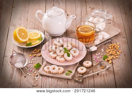 Canestrelli Biscuits With Mint On Wooden Table.