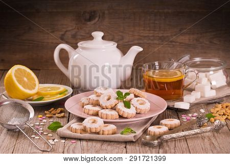 Canestrelli Biscuits With Mint On Wooden Table.