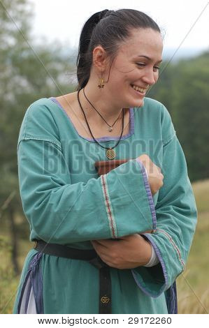 KIEV, UKRAINE - JULY 31: Member of history club Golden Capricorn wears medieval costume as she participates in historical festival in memory of King Vladimir July 31, 2009 in Kiev, Ukraine.