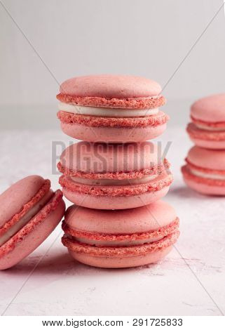 Pink Stack With Macaron On White Texutured Background Isolated On Black