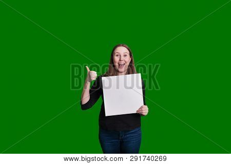 Thumbs Up Given By A Young Blond Female Holding Up A Blank White Sign Excited Expression Captured On
