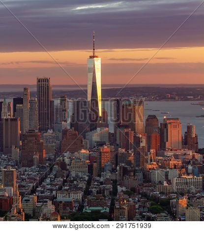 Color Landscape Photo Of The Freedom Tower In New York City. Tower Is Reflecting The Sun, Orange And