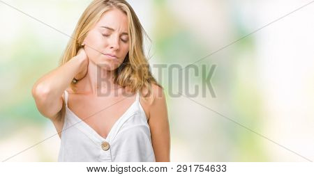 Beautiful young woman over isolated background Suffering of neck ache injury, touching neck with hand, muscular pain