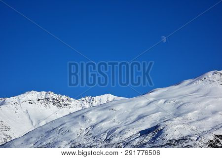 Blue Sky And White Mountains In Alaska