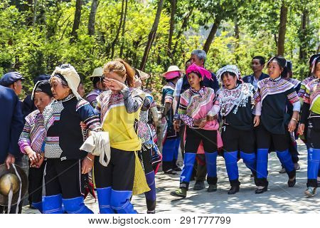 Yuanyang County, Yunnan, China - 2014: Hani Minority Villagers Returning Home After A Funeral Proces