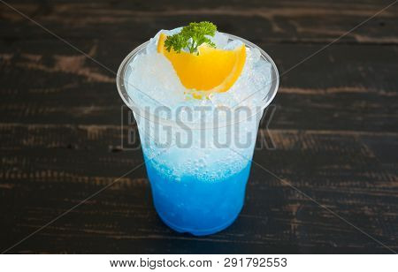Blue Italian Soda Cold Beverage And Lemon Fruit And Parsley. Blue Italian Soda Cold Beverage With Le