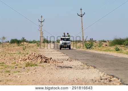 Jamba, India - April 02, 2007: Unidentified People Drive Four Wheel Car By An Asphalt Countryside Ro