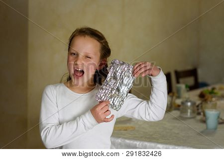 Girl Found It. Afikoman Is A Half-piece Of Matzo Which Is Broken Of The Passover Seder.in Many Famil