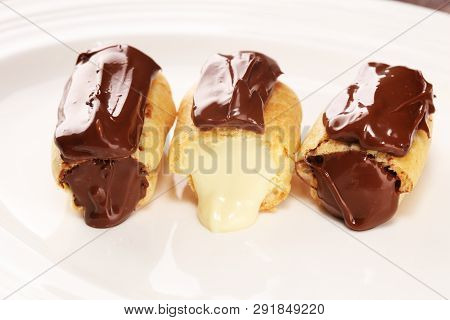 Traditional French Dessert. Eclair With Chocolate Icing. Pastery Concept With Chocolate Eclair