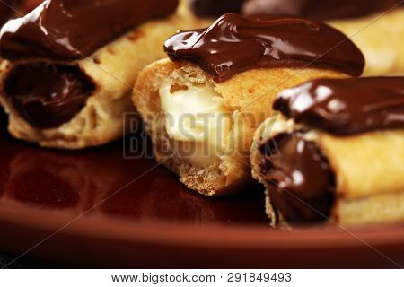 Traditional French Dessert. Eclair With Chocolate Icing. Pastery Concept With Chocolate Eclair