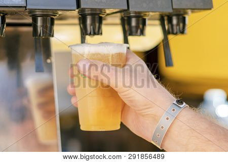 Man Pouring Fresh Drink In Self Service Bar
