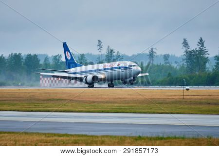 MINSK, BELARUS - JUNE 15, 2018: Belavia belarusian airlines flight Boeing 737-300 plane landing on runway in National Airport Minsk