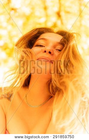 A Woman Is Posing In Front Of A Camera In An Autumn Park. Autumn Photo Shoot. Autumn In The Park.