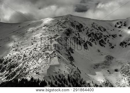 Snowy Hills In Low Tatras Mountains. Winter Peaks Landscape And Clouds On The Sky