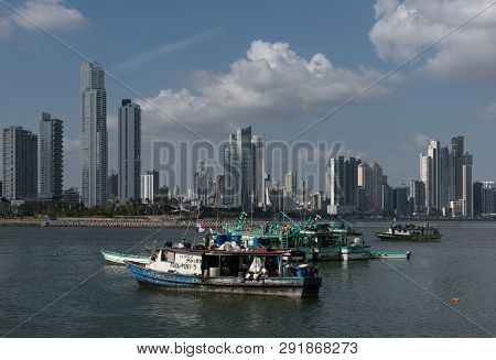 Old Fishing Boats Near Fish Market In Panama City With Skyline Background