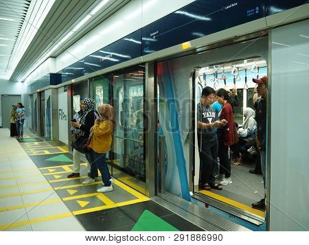 Jakarta, Indonesia - March 23, 2019: People Getting On The Train At Bundaran Hi Mrt Station.