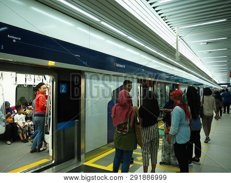 Jakarta, Indonesia - March 23, 2019: People Getting On The Train At Bundaran Hi Mrt Station.