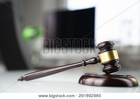 Legal Office Concept. Gavel, Computer, Scale And Hourglass On The White Table.