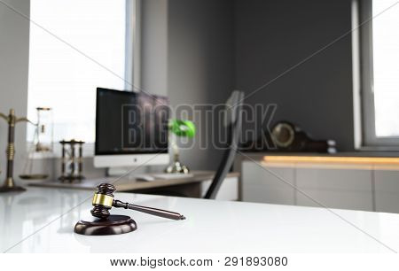 Lawyers Office. Gavel, Scale And Computer On The White Table.