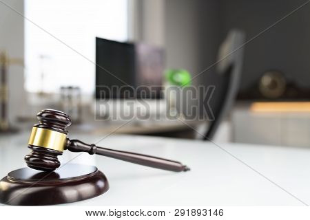 Legal Office Concept. Gavel, Computer, Scale And Hourglass On The White Table.