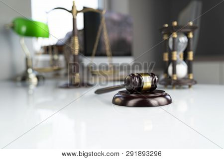Legal Office Concept. Gavel, Computer, Scale And Hourglass On The White Table.