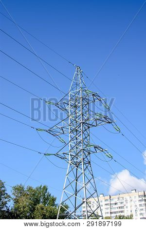 High-voltage Supports With A View Of The Blue Sky