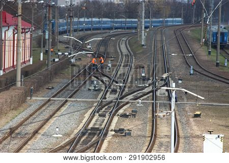 Distribution Station Railway. Rails And Sleepers, Staff Of The Railway Station In The Special Clothi