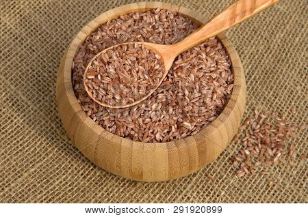 Uzbek Red Rice For Plov Is Devzira In A Bamboo Bowl On Burlap