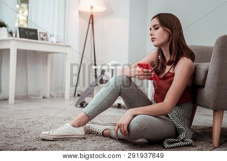 Woman In Earphones Listening To The Music