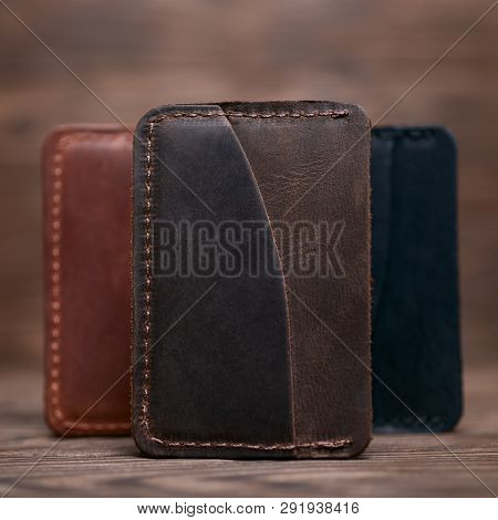 One Pocket Brown Leather Handmade Cardholder. On Blurred Background Stay Other Colour Cardholders. S
