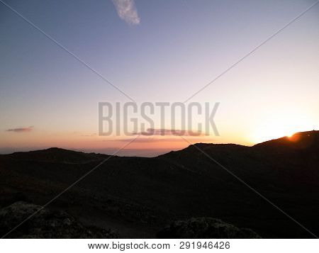 Beautiful Sunset Over Extinct Volcano Montana Roja. Montana Roja Is A Volcano On Lanzarotte, Canary 
