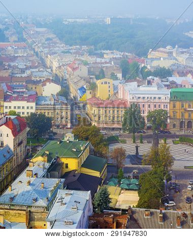 Lviv, Ukraine- September 1, 2018: Foggy Morning Of The City Center From Town Hall Tower. Tiled Roofs