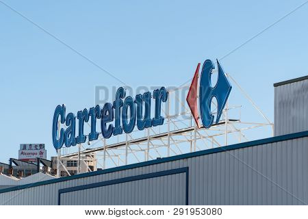 Coruna, Spain; March 26 2019: Carrefour Sign On A Facade. Carrefour Is A French Multinational Retail