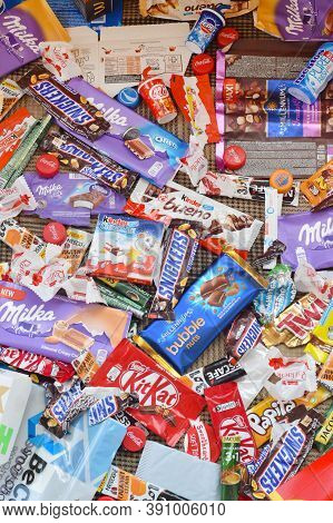 Many Wrappings And Cans From Used Products By Famous Worldwide Brands. Pattern Of Trash Of Various C