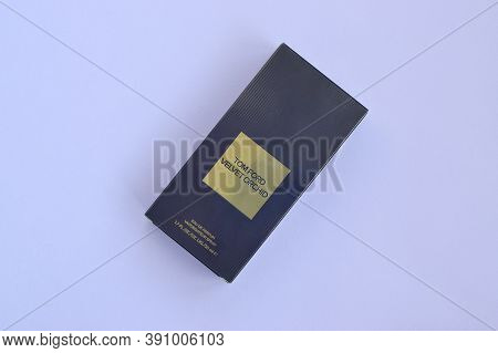Tom Ford Velvet Orchid Fragrance Perfume Bottle Lies On Light Lilac Background. Tom Ford Is American