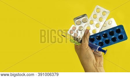 Syringe In Hand, Thermometer, Pills In Blister On Yellow Background, Top View Copy Space For Text Ba