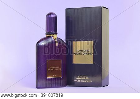 Tom Ford Velvet Orchid Fragrance Perfume Bottle Lies On Light Lilac Background. Tom Ford Is American