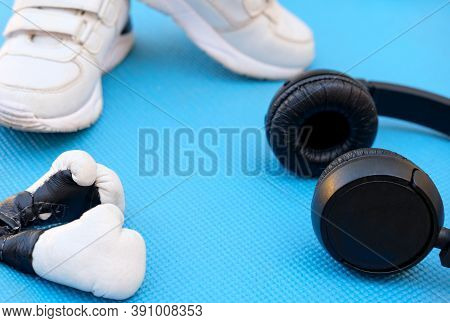 Sport Fitness Concept, Space For Text, Black Sneakers, Blue Dumbbells, Headphones, Fitness Jump Rope