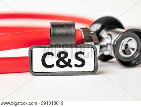 Bph Benign Prostatic Hyperplasia Lettering On A Business Card With A Holder, Next To The Red Stethos