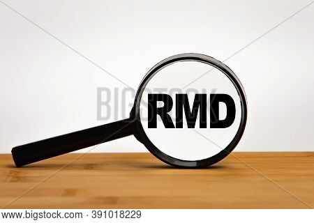 Focused On Business Concept. Magnifier Glass With Word Rmd Required Minimum Distributions On Wooden 